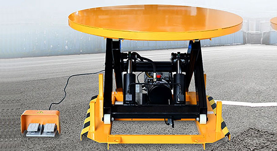 What is a rotating scissor lift table used for?